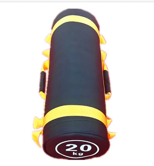 Flat white PVC fitness sandbag on gym floor, showing size and sturdy handles for weight training.
