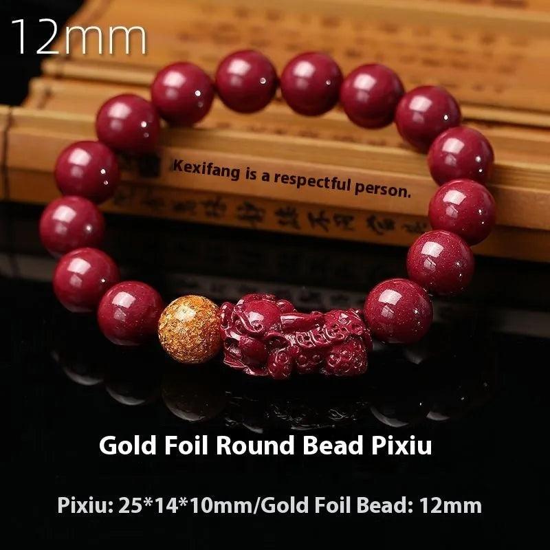 Polished purple and gold sandstone cinnabar bracelet with totem design on a wrist.
