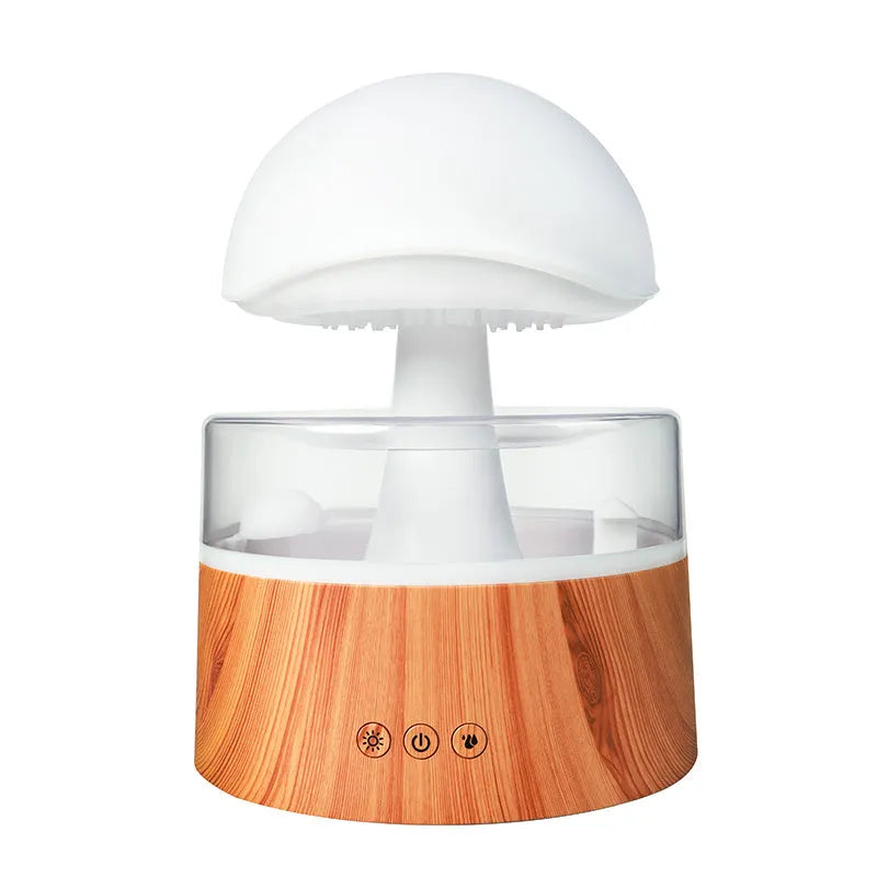 White cloud-shaped humidifier and aroma diffuser with coloured lights and simulated rain.