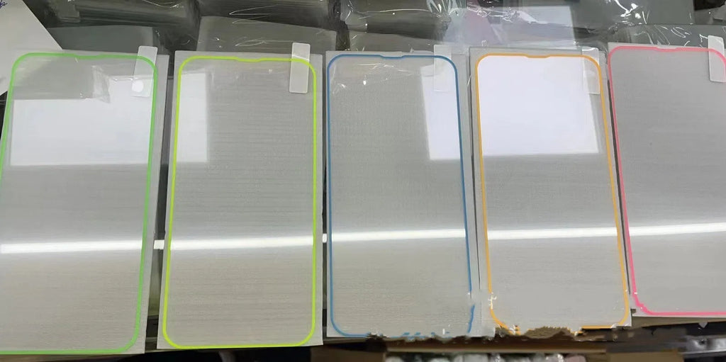 Fluorescent tempered glass screen protector for iPhone with glowing green edge on a phone