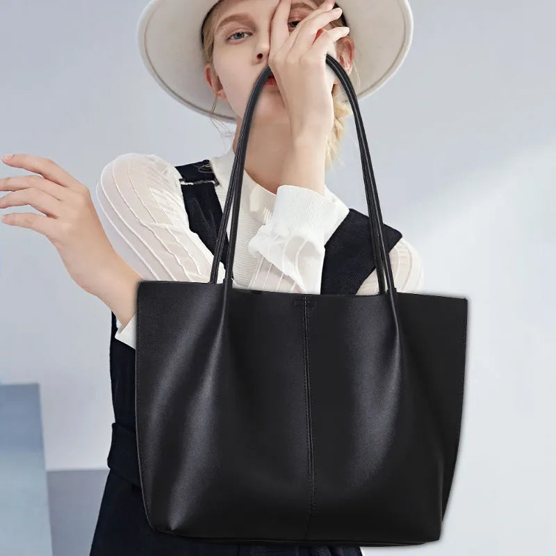 Women's large capacity PU shoulder bag in black with double straps and sewing thread detail