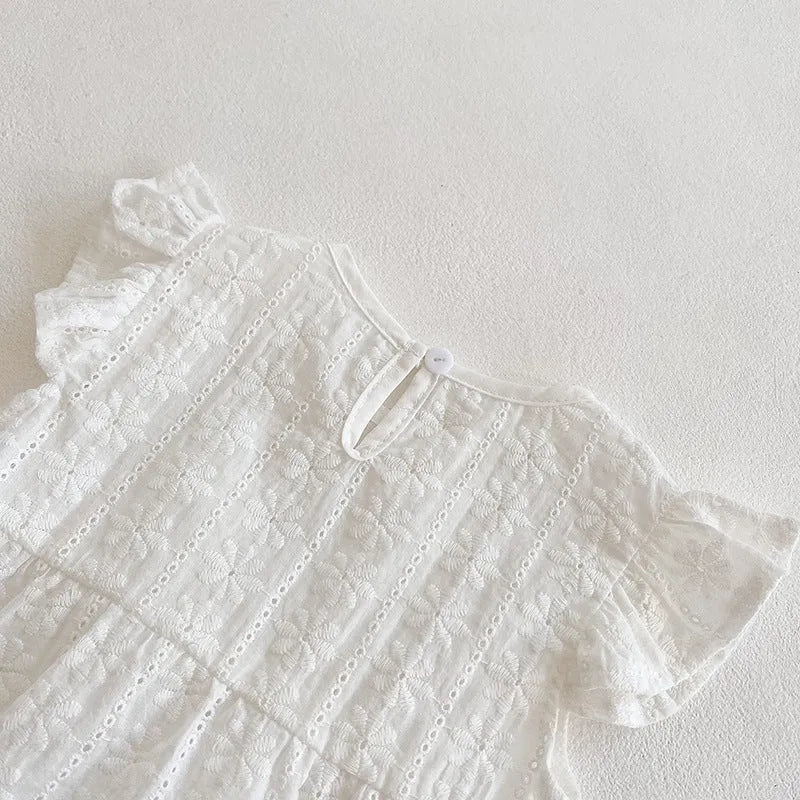 Creamy white cotton lace triangle jumpsuit for baby girl with short sleeves and button closure