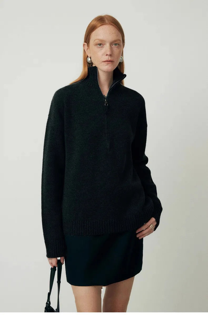 A woman's loose lapels bandage dress in wool, shown in black and grey, with long sleeves.