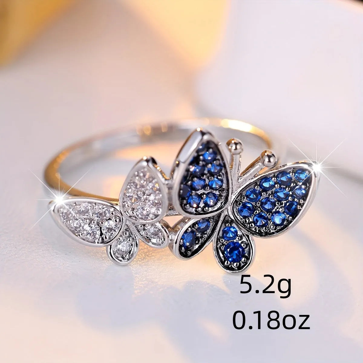 Blue and white butterfly ring for women in copper with electroplated finish, sizes 6-10