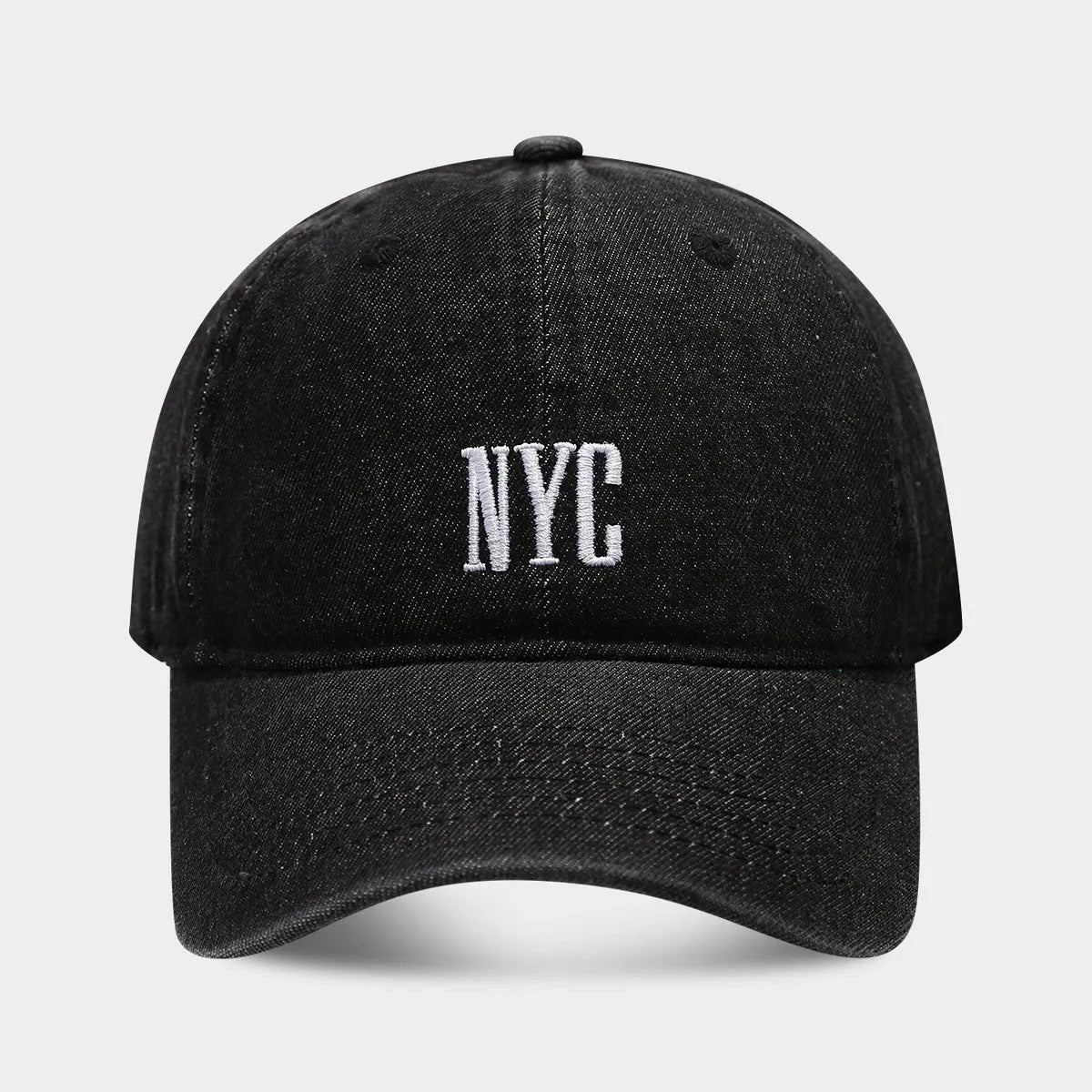 Adjustable denim peaked cap with a dome crown and a large English letter design on the front.