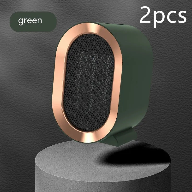 Compact black desktop electric fan heater with a front grille and mechanical control dials.