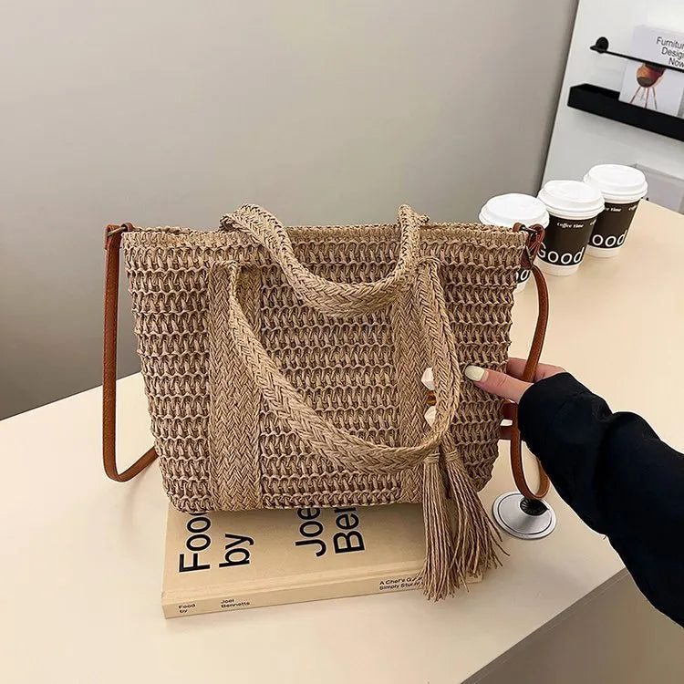 Women's straw woven crossbody shoulder bag showing diagonal weave pattern in milky white colour