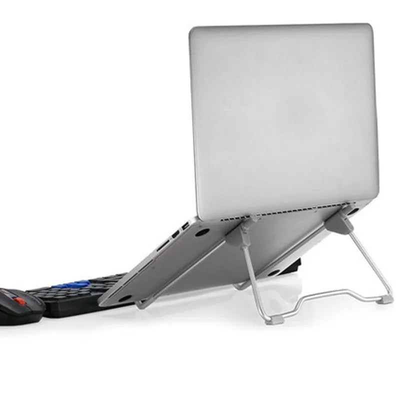 Grey aluminium alloy and engineering plastic adjustable stand holding a mobile phone and a laptop.