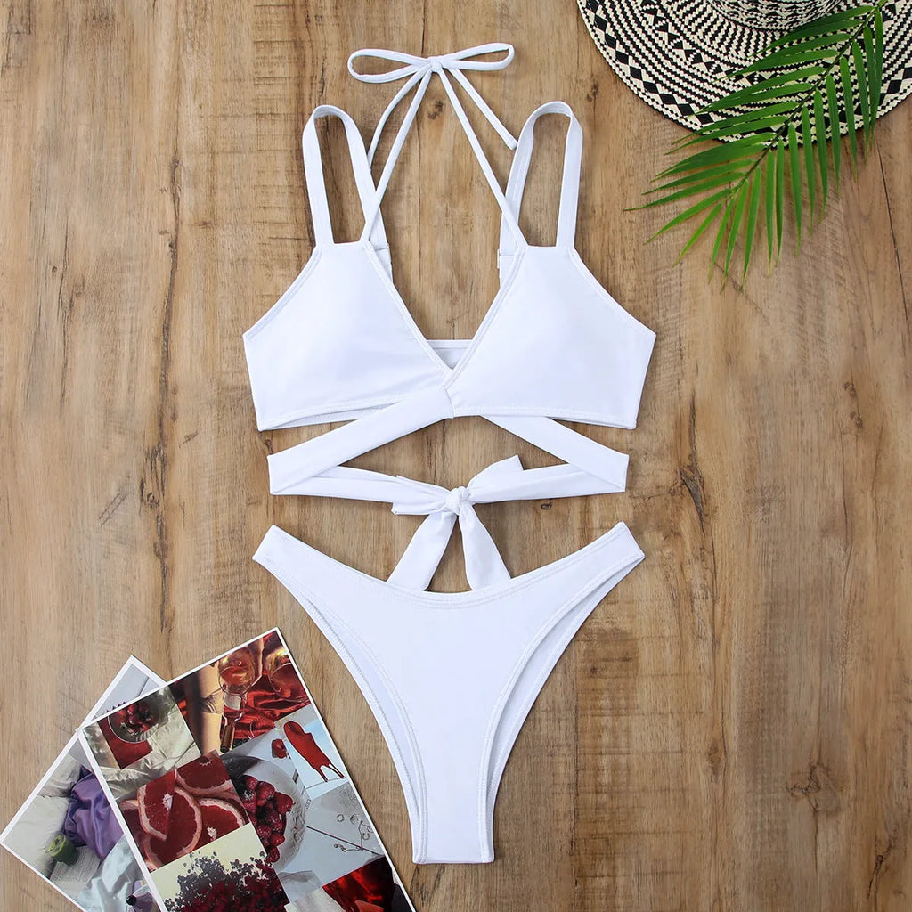 Solid colour women's brief bikini swimsuit on a mannequin, showcasing the strap design.