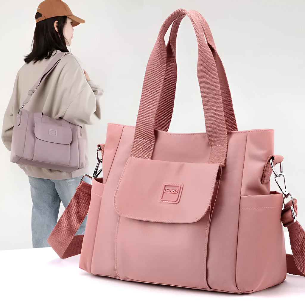 Nylon multi-interlayer shoulder bag in black with single strap and outer sandwich pocket, horizontal square shape