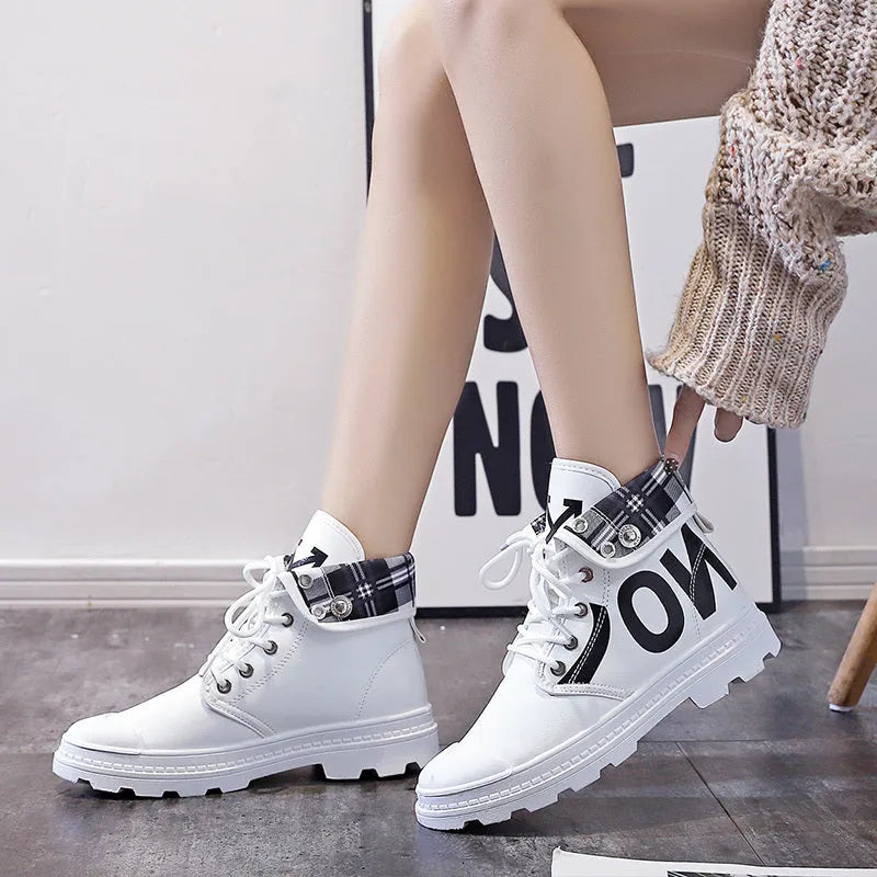 Canvas high-top Martin boots for women with cross straps and bows, in black, side view