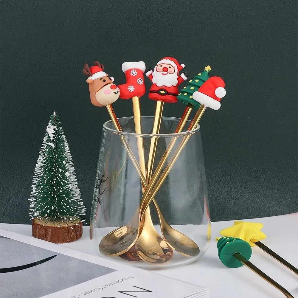 Red stainless steel Christmas spoon and fork set with festive handle designs including trees and snowmen