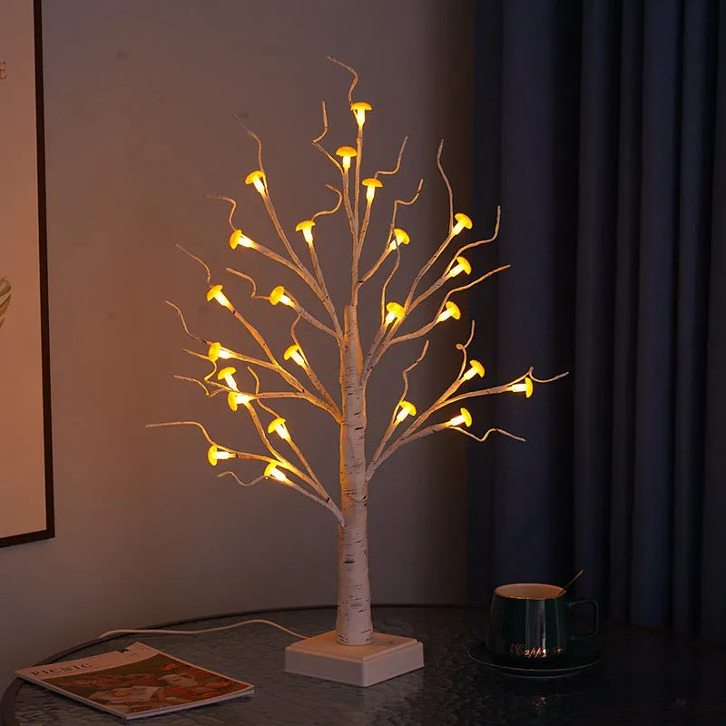 60 cm tall white birch tree LED lamp with small mushroom-shaped flowers glowing with warm light.