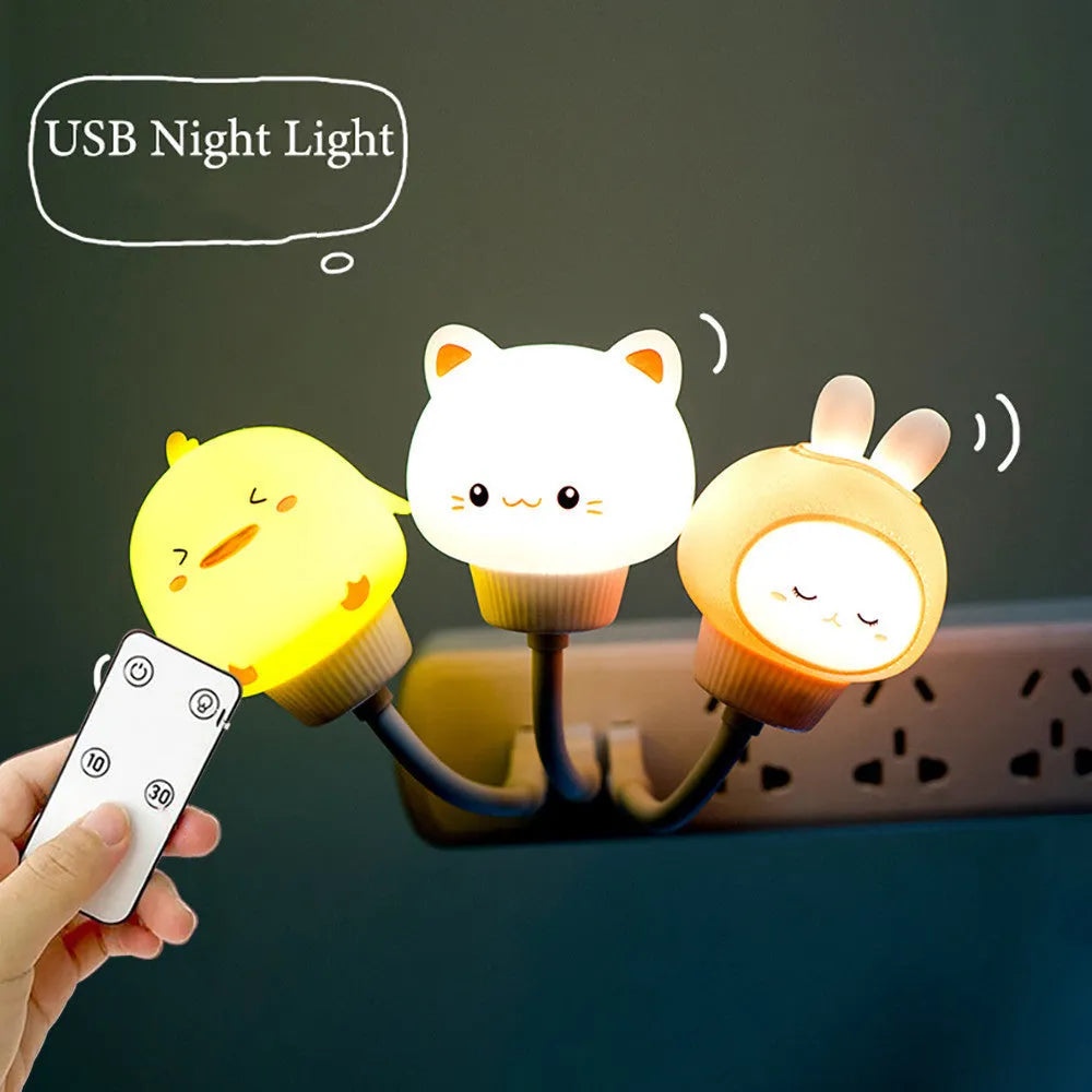 White USB cartoon animal night light in bear design with remote control on wooden table.
