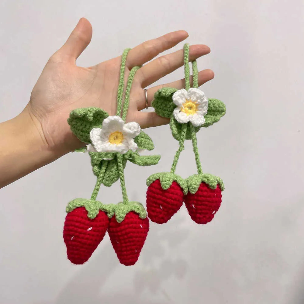 Handmade strawberry-shaped car pendant made from cotton and hemp knitting wool.
