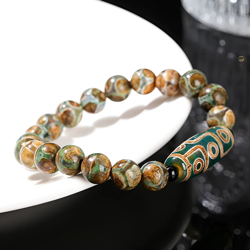 Handmade barrel shaped Dzi bead bracelet in green with geometry design
