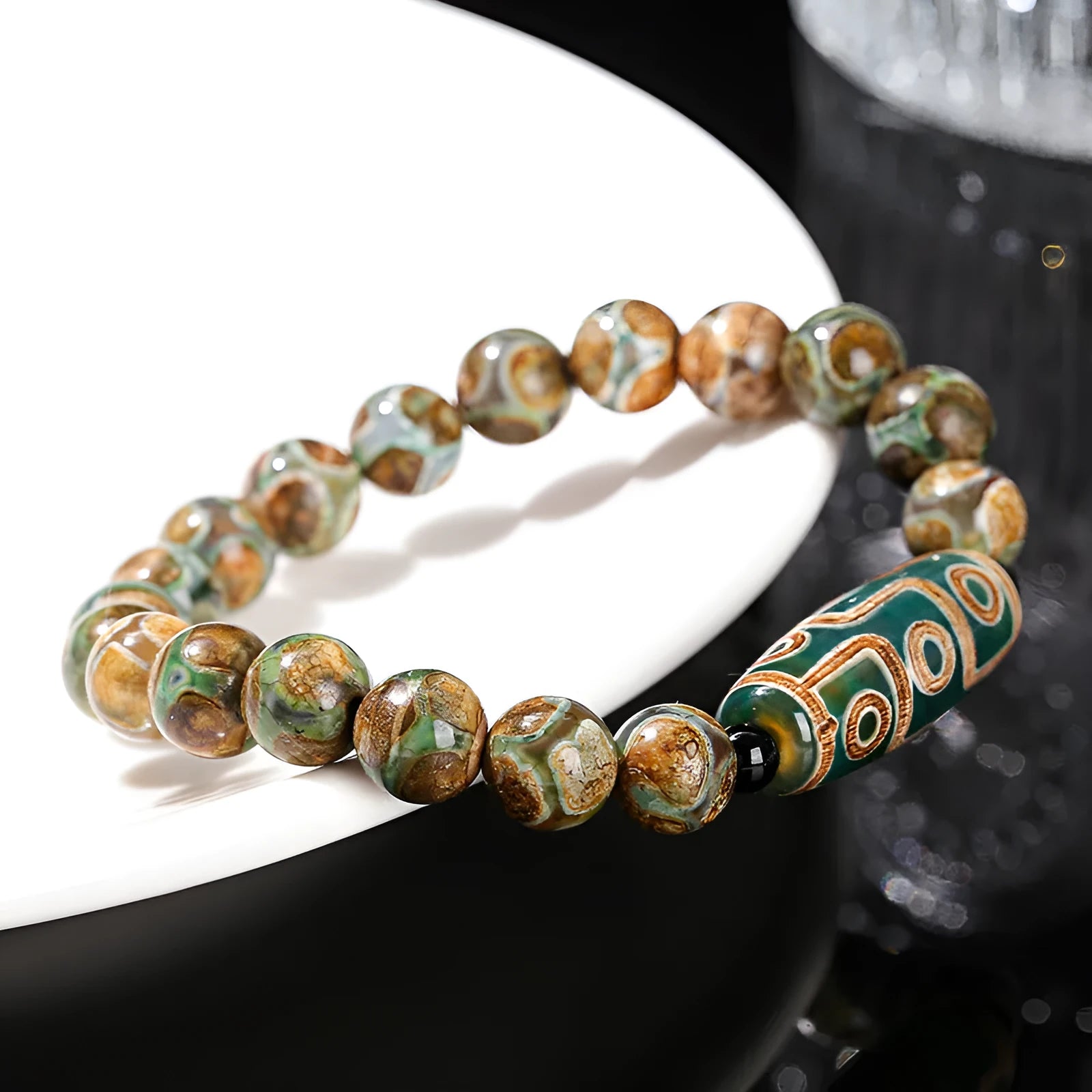 Handmade barrel shaped Dzi bead bracelet in green with geometry design