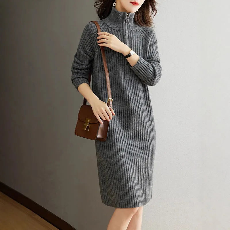 Beige half-zip woollen midi dress with long sleeves and a stand collar, laid flat.
