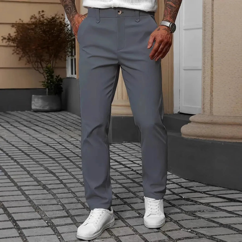 Men's straight-leg business casual trousers in apricot colour on a hanger.