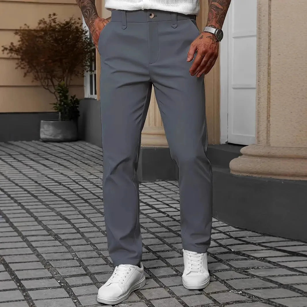 Men's straight-leg business casual trousers in apricot colour on a hanger.