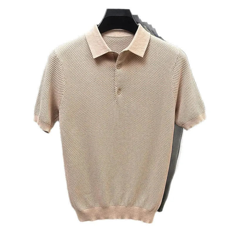 Man wearing a loose grey cotton short sleeve pullover sweater for casual leisure wear.
