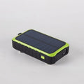 Orange and green hand solar mobile power bank with solar panel and hand crank showing dual USB ports