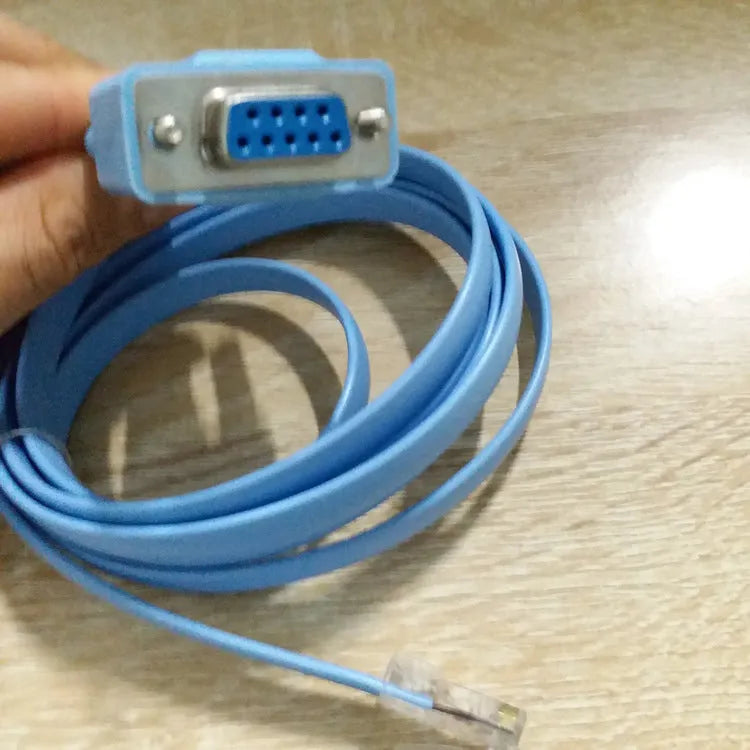 Sky-blue flat RJ45 to DB9 serial console cable with copper conductors, 1.5 metres long