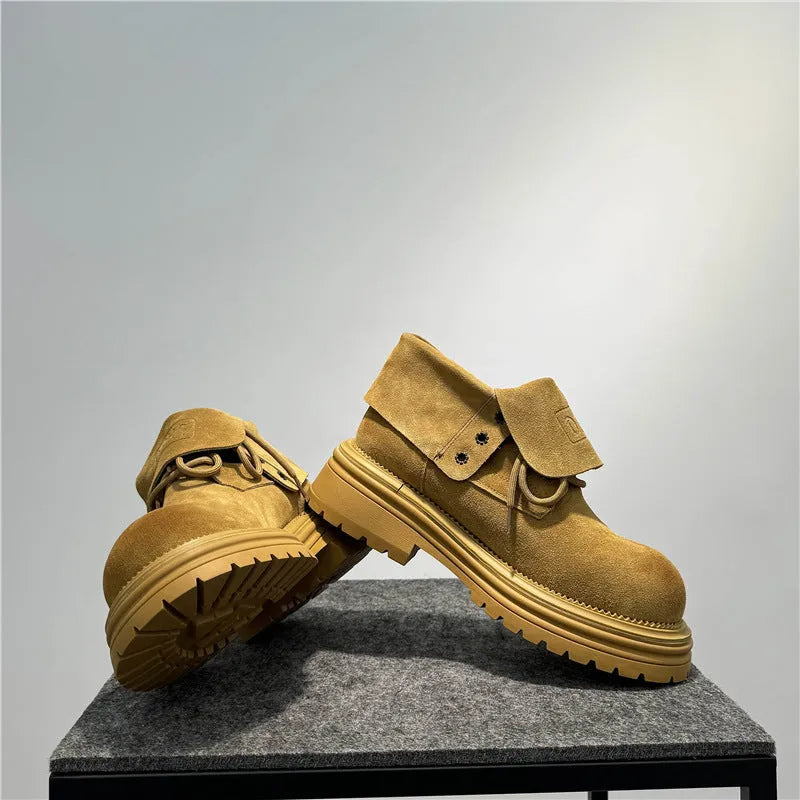 Retro distressed suede work boots with thick soles and sewing line detailing in camel colour