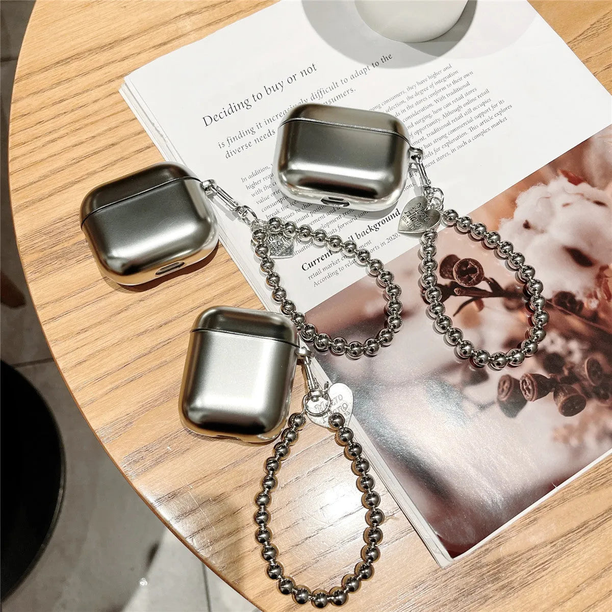 Matte plating colour TPU protective case for AirPods with an attached carrying bracelet.