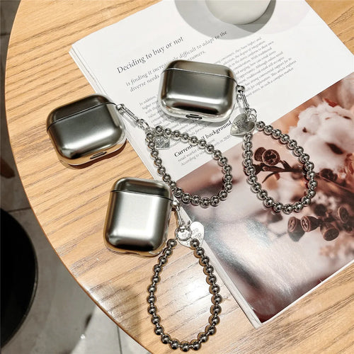 Matte plating colour TPU protective case for AirPods with an attached carrying bracelet.