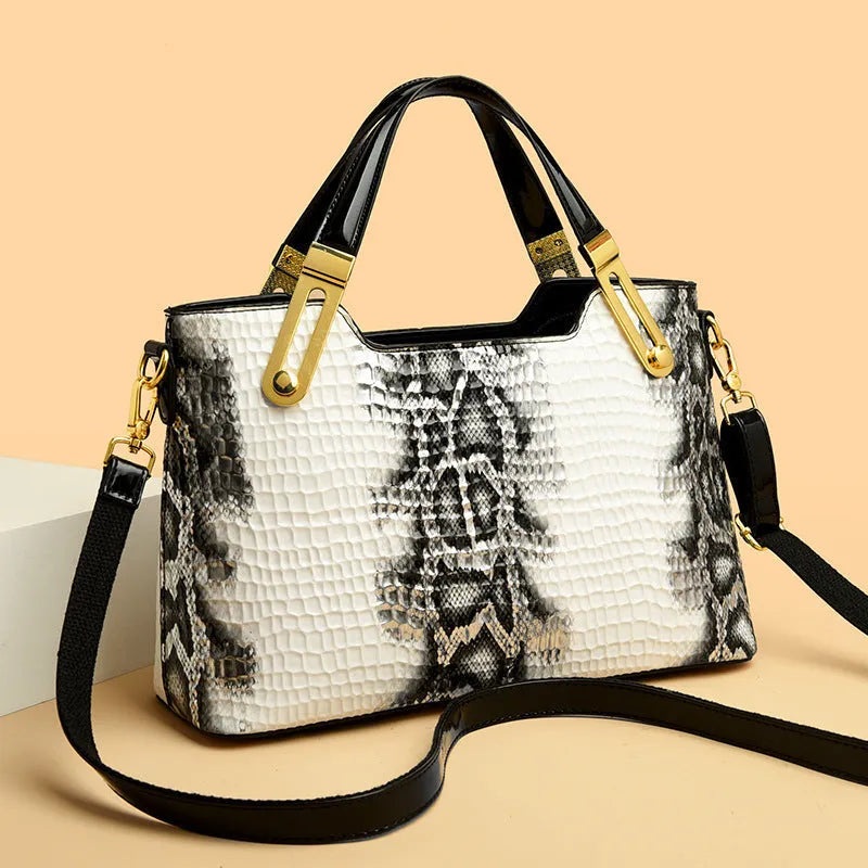Black horizontal square messenger bag with chain strap and multiple compartments