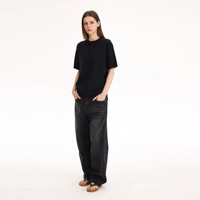 Fanio solid colour short-sleeve T-shirt in black velvet fabric on a hanger.