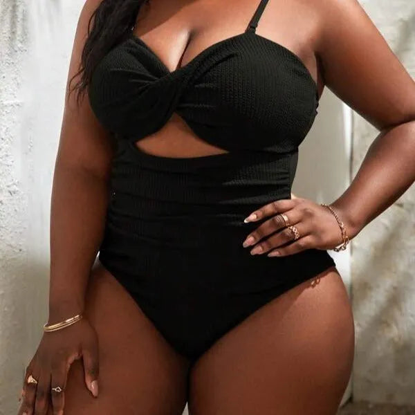 Plus size women's black sling triangle one-piece swimsuit with polyester and spandex stretch fabric