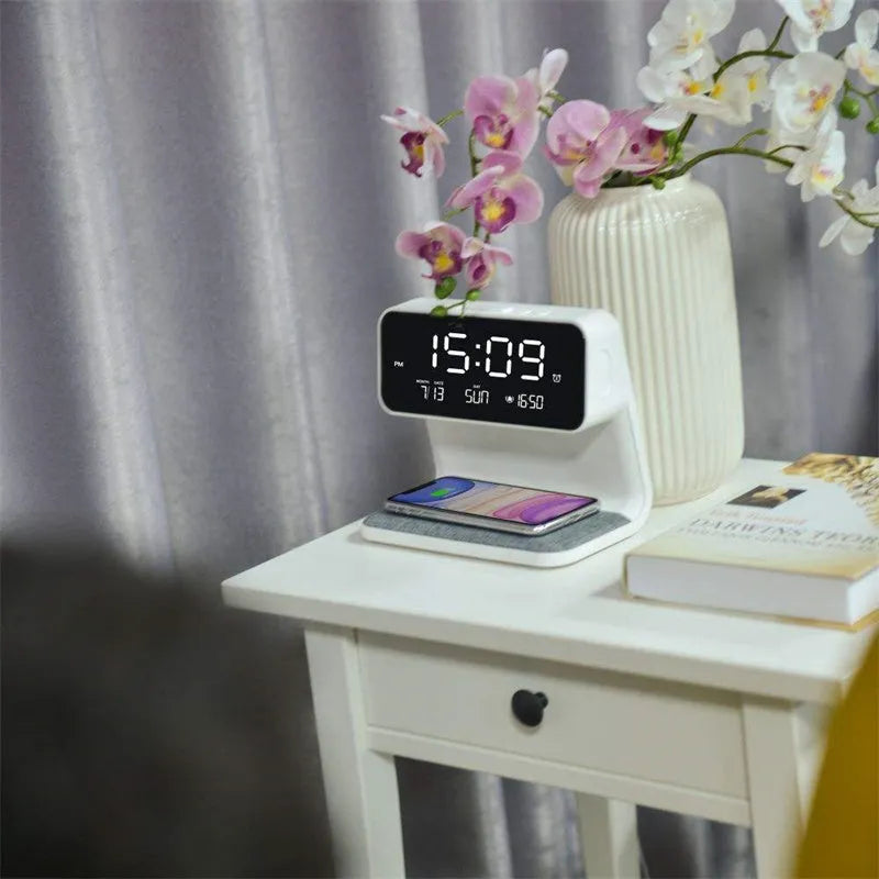 White bedside lamp with integrated wireless charging pad and LCD alarm clock display