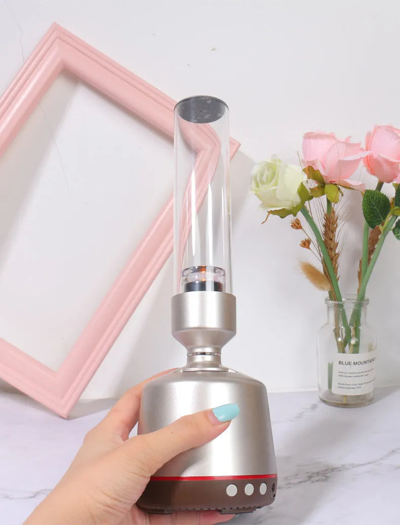White silver candlelight Bluetooth speaker night light with modern design and push-button controls.