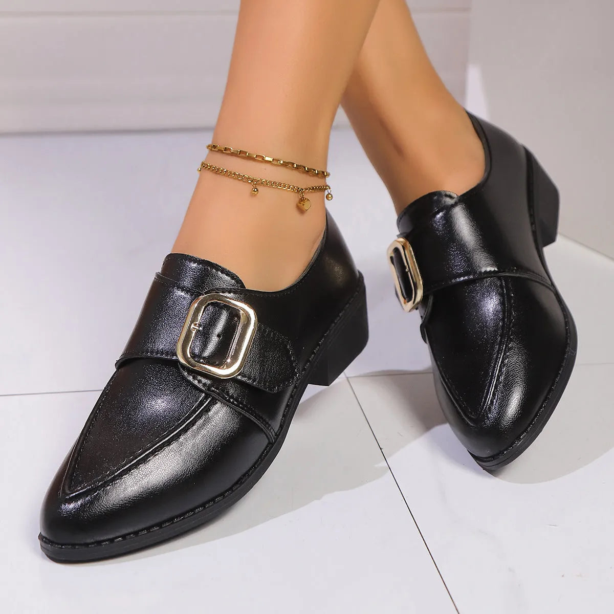 Women's pointed toe shoes with a choice of large buckle bow or small bowknot detail on a PU leather upper.