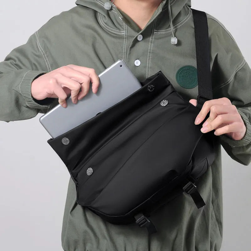 Grey men's crossbody sling backpack made of PU with a zipper and patch pocket.