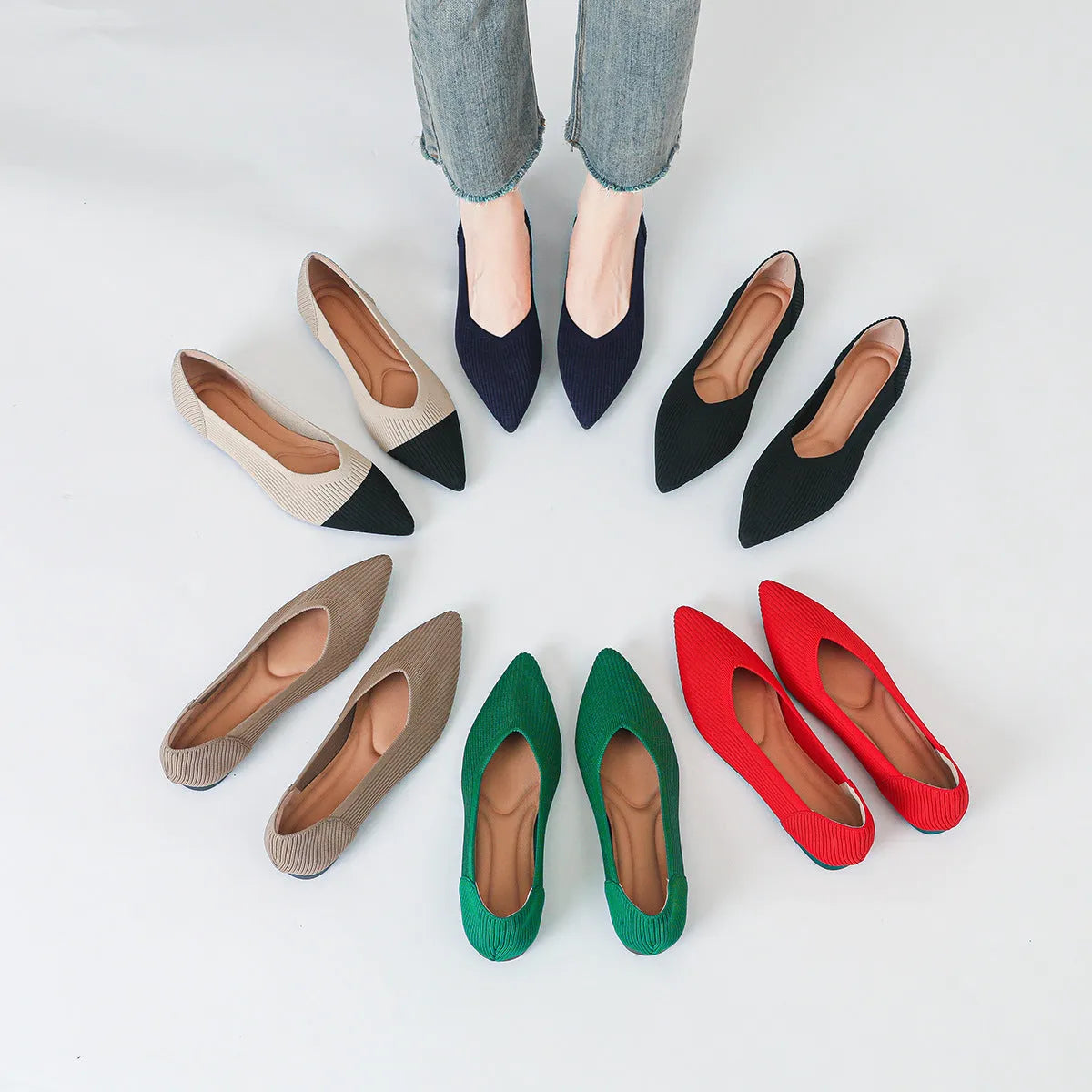 Women's apricot-coloured knit flat pumps with a pointed toe and slip-on design on a white background.