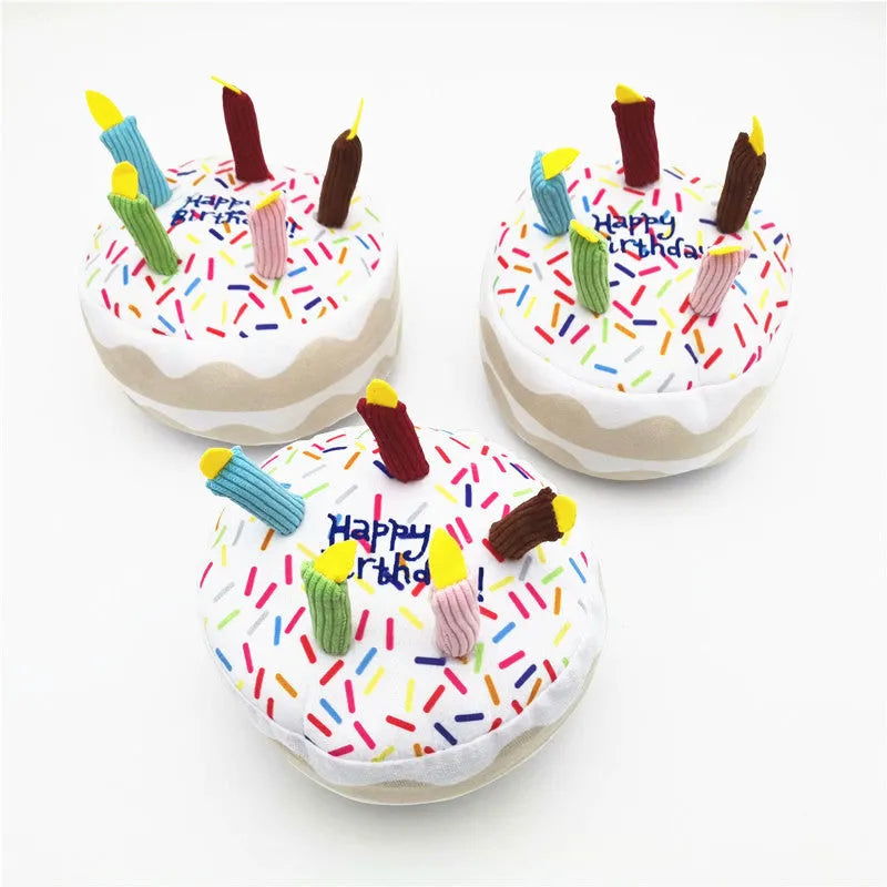 Four-piece dog birthday cake plush toy set including big cake, small cake, gift box, and bone on white background