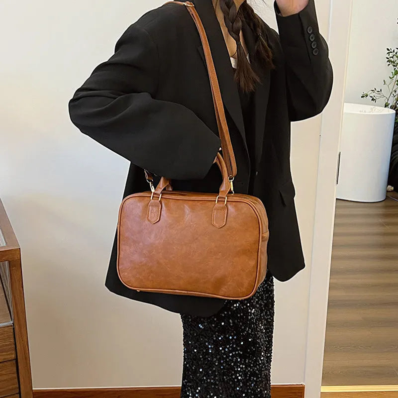 Small PU crossbody bag for women with zipper closure and hidden pocket in Black, Bronze, or Coffee