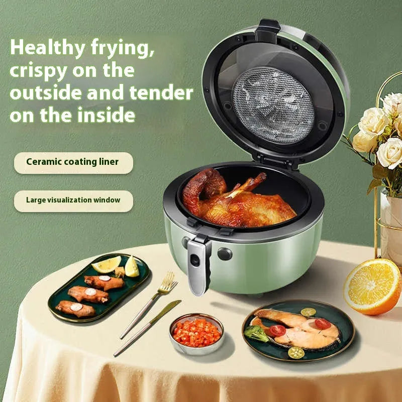 Silver mechanical button air fryer with transparent lid showing 8-litre nano-ceramic cooking basket inside.