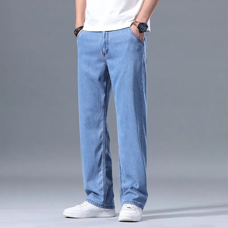 Men's loose fit straight-leg Lyocell jeans in a blue colour with a zip fly.