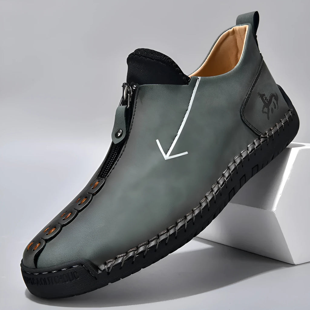 Men's brown front-zipper Martin boots with a round toe and mid-calf height on a rubber sole.