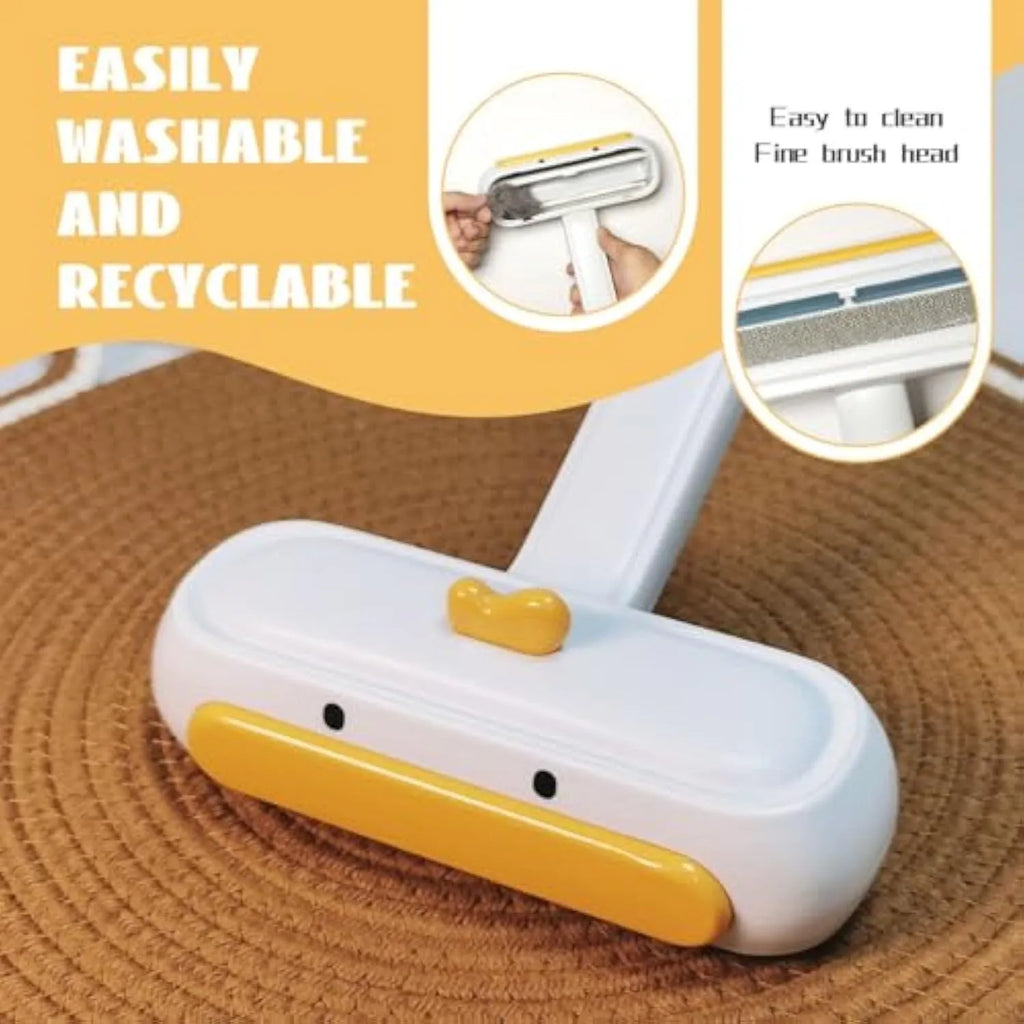 Portable pet hair remover with yellow duck design and removable lid on a fabric sofa.