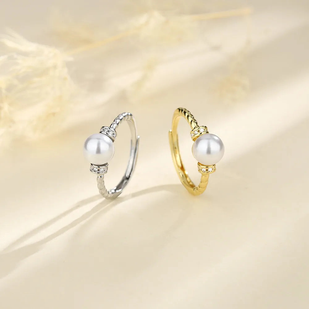 Antique twist pearl ring in copper with adjustable size and geometric design, available in gold or silver colour.