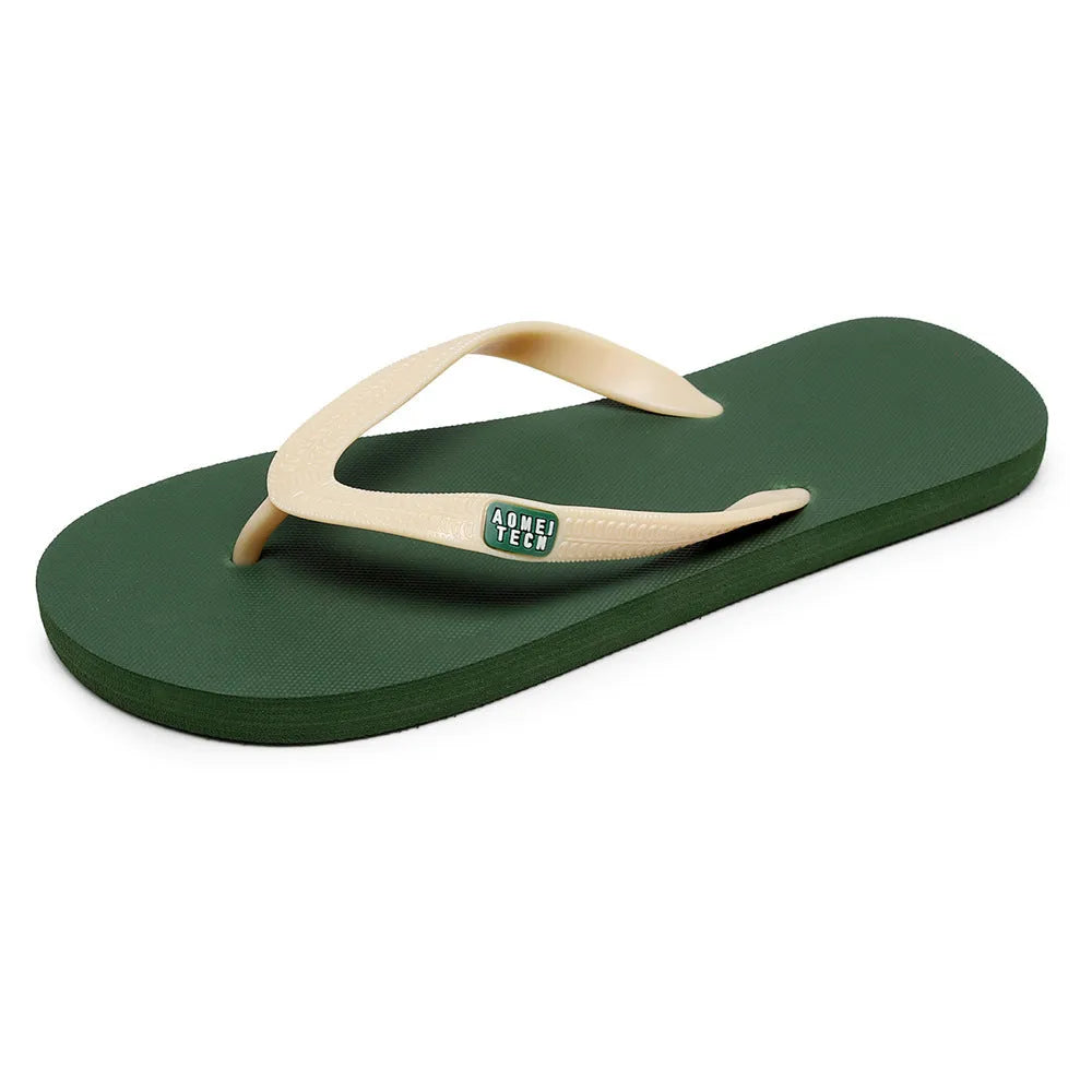Men's black flip-flops with a textured rubber sole and a lightweight EVA upper on a sandy beach.
