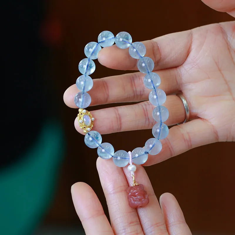 Aquamarine beaded bracelet with Chinese fengjiu fox charm in pearl or pink crystal colour variations