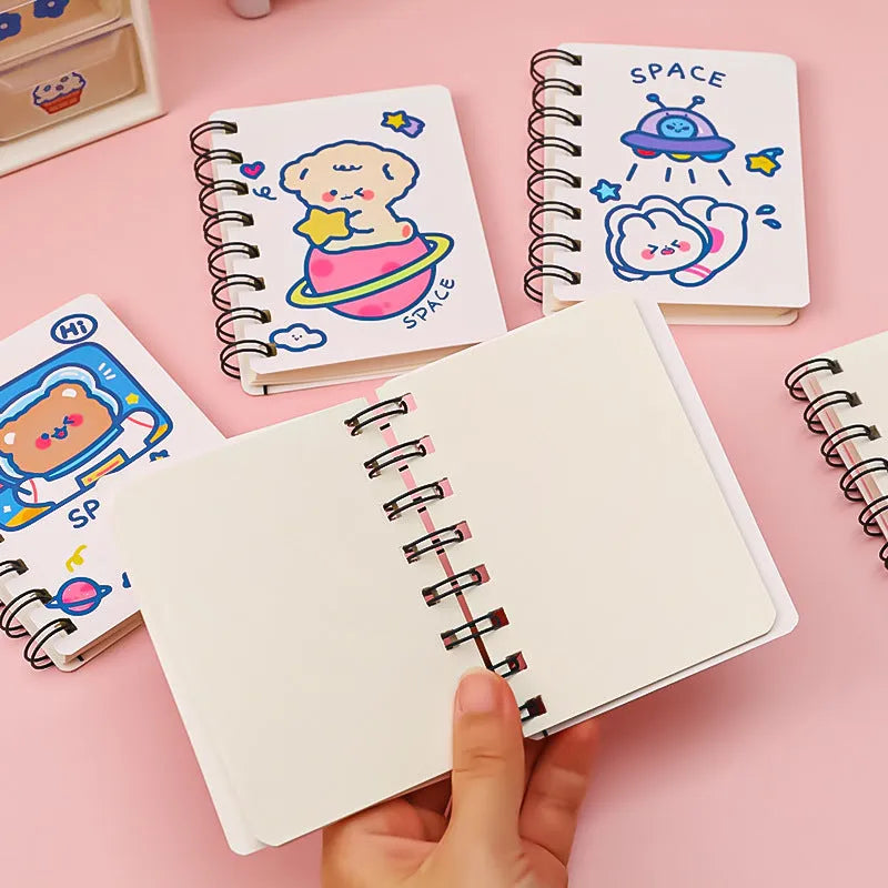 Compact astronaut series flip notebook with space-themed cover, shown closed.