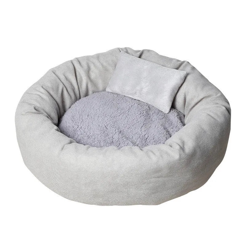 Light grey cotton-filled dog bed for a medium-sized dog with a matching pillow.