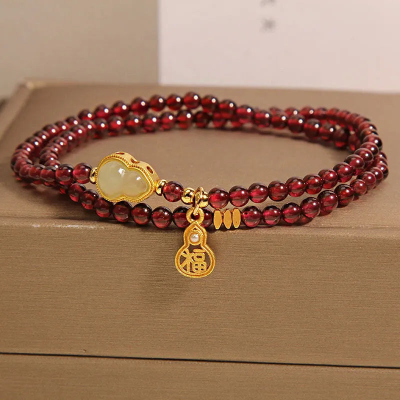 Chinese-style gourd bracelet with imitation garnet beads and Fu character symbols on U-shaped electroplated setting